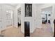 Inviting hallway with a bedroom and bathroom doorway, storage and decorative London painting at 2271 Rolling Trl, Lithonia, GA 30058