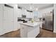 Bright, all-white kitchen featuring granite countertops and stainless steel appliances at 2271 Rolling Trl, Lithonia, GA 30058