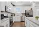 A modern kitchen featuring stainless steel appliances and granite countertops at 2271 Rolling Trl, Lithonia, GA 30058