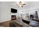 Open living room with fireplace flowing into a bright, modern kitchen at 2271 Rolling Trl, Lithonia, GA 30058