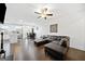 Open-concept living space featuring a modern kitchen, living room with a fireplace, and dining area at 2271 Rolling Trl, Lithonia, GA 30058