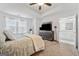 Comfortable main bedroom suite with neutral carpet and a private ensuite bathroom at 2271 Rolling Trl, Lithonia, GA 30058
