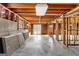 Unfinished basement with exposed framing, concrete floor, and access to the backyard at 210 Heritage Cir, Mcdonough, GA 30253