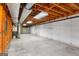 Spacious unfinished basement with concrete walls, exposed ceiling, and a utility area at 210 Heritage Cir, Mcdonough, GA 30253