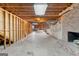 Unfinished basement with a fireplace, exposed ceiling, and concrete flooring, ready for customization at 210 Heritage Cir, Mcdonough, GA 30253