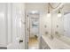 Bright bathroom with double sink vanity, and natural light at 210 Heritage Cir, Mcdonough, GA 30253