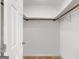 Empty walk-in closet featuring white walls and carpeted floor at 210 Heritage Cir, Mcdonough, GA 30253