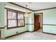 Dining area with a chandelier, large windows and wood trim detail at 210 Heritage Cir, Mcdonough, GA 30253