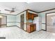 Dining area with tile flooring, chandelier, wooden cabinets and light green paint at 210 Heritage Cir, Mcdonough, GA 30253