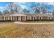 Inviting brick home with classic white trim, well-manicured landscaping, and a welcoming entrance at 210 Heritage Cir, Mcdonough, GA 30253