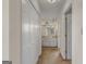 Hallway leading to a bathroom featuring a closet and carpeted floor at 210 Heritage Cir, Mcdonough, GA 30253