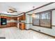 Open kitchen featuring wood cabinets, tile floor, stainless steel appliances, and bright breakfast nook at 210 Heritage Cir, Mcdonough, GA 30253