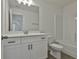 White bathroom with vanity, mirror, and shower-tub, providing a clean and modern space at 6025 Old Timber Trl # 11, Douglasville, GA 30135