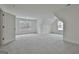 Spacious bedroom with neutral carpet, natural light from windows, and an open door at 6025 Old Timber Trl # 11, Douglasville, GA 30135