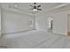 Spacious bedroom featuring a trey ceiling and view into the bathroom at 6025 Old Timber Trl # 11, Douglasville, GA 30135