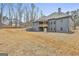 View of the back of the home with an exterior elevation and large backyard at 6025 Old Timber Trl # 11, Douglasville, GA 30135