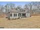 Charming exterior with a stylish combination of gray siding and stone accents enhancing the curb appeal at 6025 Old Timber Trl # 11, Douglasville, GA 30135