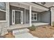 Inviting front porch with classic columns and stylish lighting, adding to the home's appeal at 6025 Old Timber Trl # 11, Douglasville, GA 30135