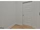 A white five-panel door with satin nickel hardware at 6025 Old Timber Trl # 11, Douglasville, GA 30135