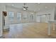 Open living room featuring a stone fireplace, recessed lighting, and sliding barn doors at 6025 Old Timber Trl # 11, Douglasville, GA 30135