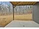 View of the home's covered patio, with gray siding and backyard view at 6025 Old Timber Trl # 11, Douglasville, GA 30135