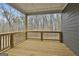 Covered wooden porch with railings and wooded view, ideal for outdoor relaxation at 6025 Old Timber Trl # 11, Douglasville, GA 30135