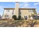 The backyard of this lovely home has a patio and beautiful plants and bushes at 6142 Golf View Xing, Locust Grove, GA 30248