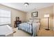 Comfortable bedroom with plenty of natural light, soft carpet, and neutral wall color at 6142 Golf View Xing, Locust Grove, GA 30248