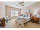 Cozy bedroom featuring neutral walls, a large window for natural light, and comfortable furnishings at 6142 Golf View Xing, Locust Grove, GA 30248