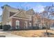 Beautiful home featuring manicured lawn, multi-pane windows, and brick/stone combination at 6142 Golf View Xing, Locust Grove, GA 30248