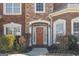 Charming front entryway featuring a wreath, sidelights and brick/stone facade at 6142 Golf View Xing, Locust Grove, GA 30248