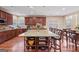 Spacious kitchen with granite countertops, island with seating, and stainless steel appliances at 6142 Golf View Xing, Locust Grove, GA 30248