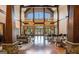 Clubhouse lobby with high ceilings, chandeliers, lounge seating, and dining tables at 6142 Golf View Xing, Locust Grove, GA 30248