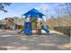 Bright community playground with slides and climbing structures under a blue sky at 6142 Golf View Xing, Locust Grove, GA 30248