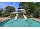 Community pool area featuring a large water slide and sun umbrellas at 6142 Golf View Xing, Locust Grove, GA 30248