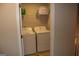 Convenient upstairs laundry closet with washer and dryer at 113 Lantana Dr, Locust Grove, GA 30248