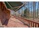 A roomy back deck features an awning to create a shaded and inviting outdoor space at 562 Adams Rd, Fayetteville, GA 30214
