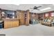 Spacious wood paneled basement featuring carpet floors and built-in bookshelves at 562 Adams Rd, Fayetteville, GA 30214