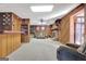 Spacious wood paneled basement featuring brick fireplace, and carpet floors at 562 Adams Rd, Fayetteville, GA 30214