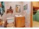 Bathroom with tiled floor, wallpaper and wooden cabinets at 562 Adams Rd, Fayetteville, GA 30214