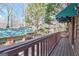 Exterior view from the deck with awning featuring wood railings overlooking the yard at 562 Adams Rd, Fayetteville, GA 30214
