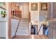 Welcoming foyer with staircase leading to a split level with wood flooring and charming decor at 562 Adams Rd, Fayetteville, GA 30214