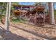 View of a multi-level wood home featuring decks, stairs, and lake access at 562 Adams Rd, Fayetteville, GA 30214