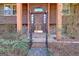 Inviting front entrance with a rustic wood door and brick pathway leading to a cozy home at 562 Adams Rd, Fayetteville, GA 30214