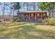 Charming single-Gathering home featuring a cozy front porch and well-maintained landscaping at 562 Adams Rd, Fayetteville, GA 30214