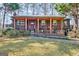 Charming single-Gathering home featuring a cozy front porch and well-maintained landscaping at 562 Adams Rd, Fayetteville, GA 30214