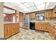 Well-lit kitchen featuring stainless steel appliances, ample counter space, and a convenient layout at 562 Adams Rd, Fayetteville, GA 30214