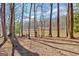 Lakeside view with lounge chairs on a dock under blue skies at 562 Adams Rd, Fayetteville, GA 30214