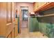 Laundry room with tiled floor and cabinets at 562 Adams Rd, Fayetteville, GA 30214