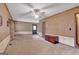A spacious living room with a ceiling fan and ample space for furniture and decor at 562 Adams Rd, Fayetteville, GA 30214
